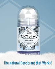 Crystal mineral deodorant stick labeled unscented sits on a snowy surface with a blue backdrop.
