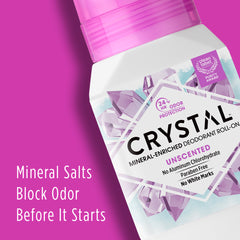 Close up of Crystal mineral enriched deodorant roll-on against a bright pink background