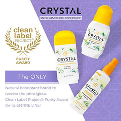 CRYSTAL deodorant bottles with yellow caps on a purple geometric background beside Clean Label Project purity award