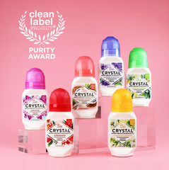 Assorted Crystal mineral deodorant bottles arranged on a pink background with the Clean Label Project purity award emblem.