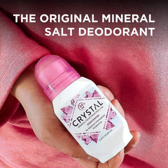 Crystal cucumber mint mineral deodorant bottle with cucumber slices and mint leaves nearby.