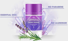 Purple Crystal lavender and rosemary essential oil bottle surrounded by lavender and rosemary sprigs with no parabens and no aluminum labels.