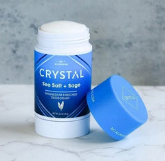 Crystal Sea Salt and Sage magnesium deodorant bottle with blue cap beside it