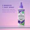 Crystal whole body deodorant spray bottle with lavender and white tea flavor on a pink and purple gradient background.