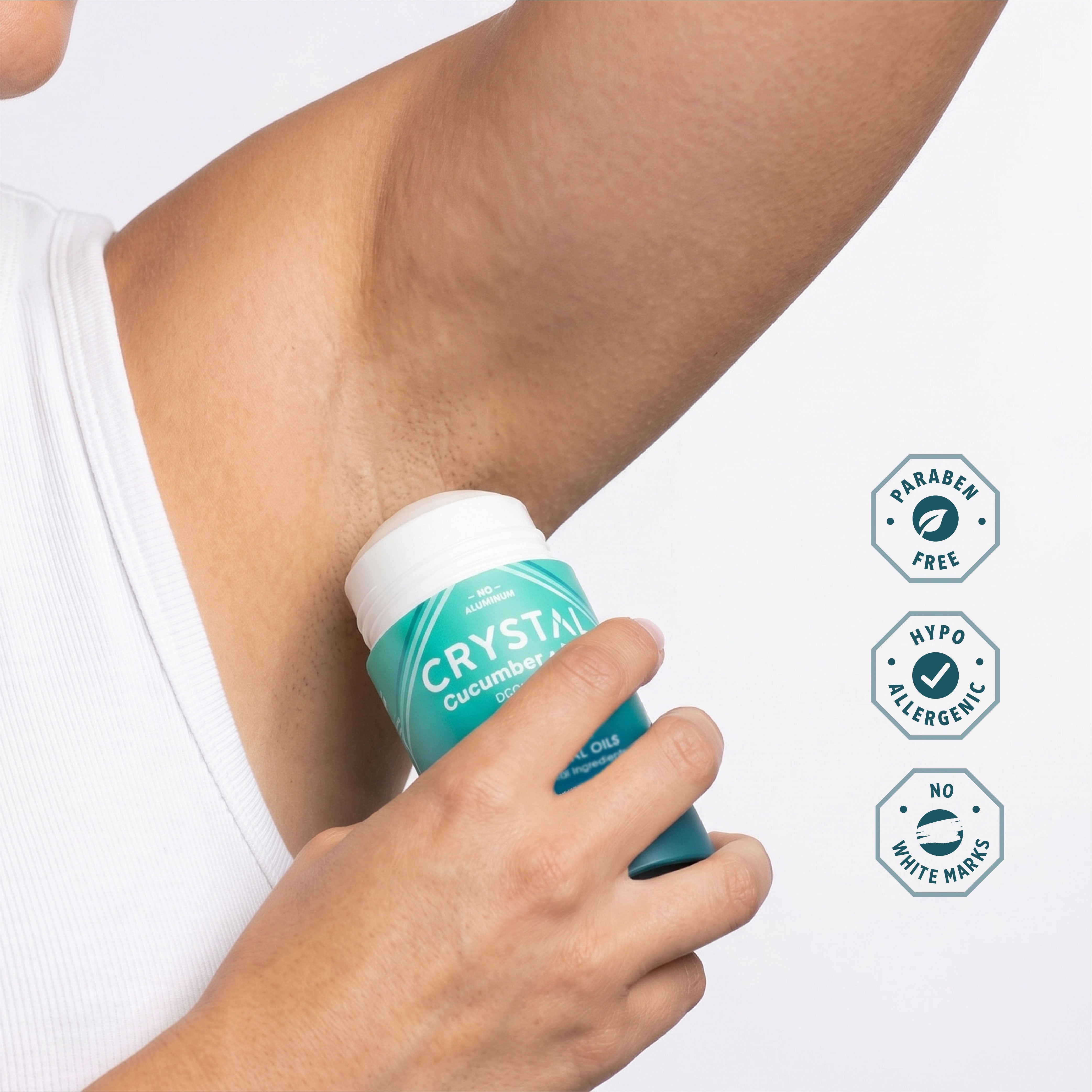 Crystal Cucumber Mint Mineral deodorant stick being applied to an underarm.