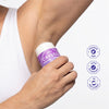 Person applying Crystal Lavender and Rosemary Magnesium stick deodorant on white background.