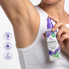 Person holding a bottle of Crystal Whole Body Deodorant with product details on a white background