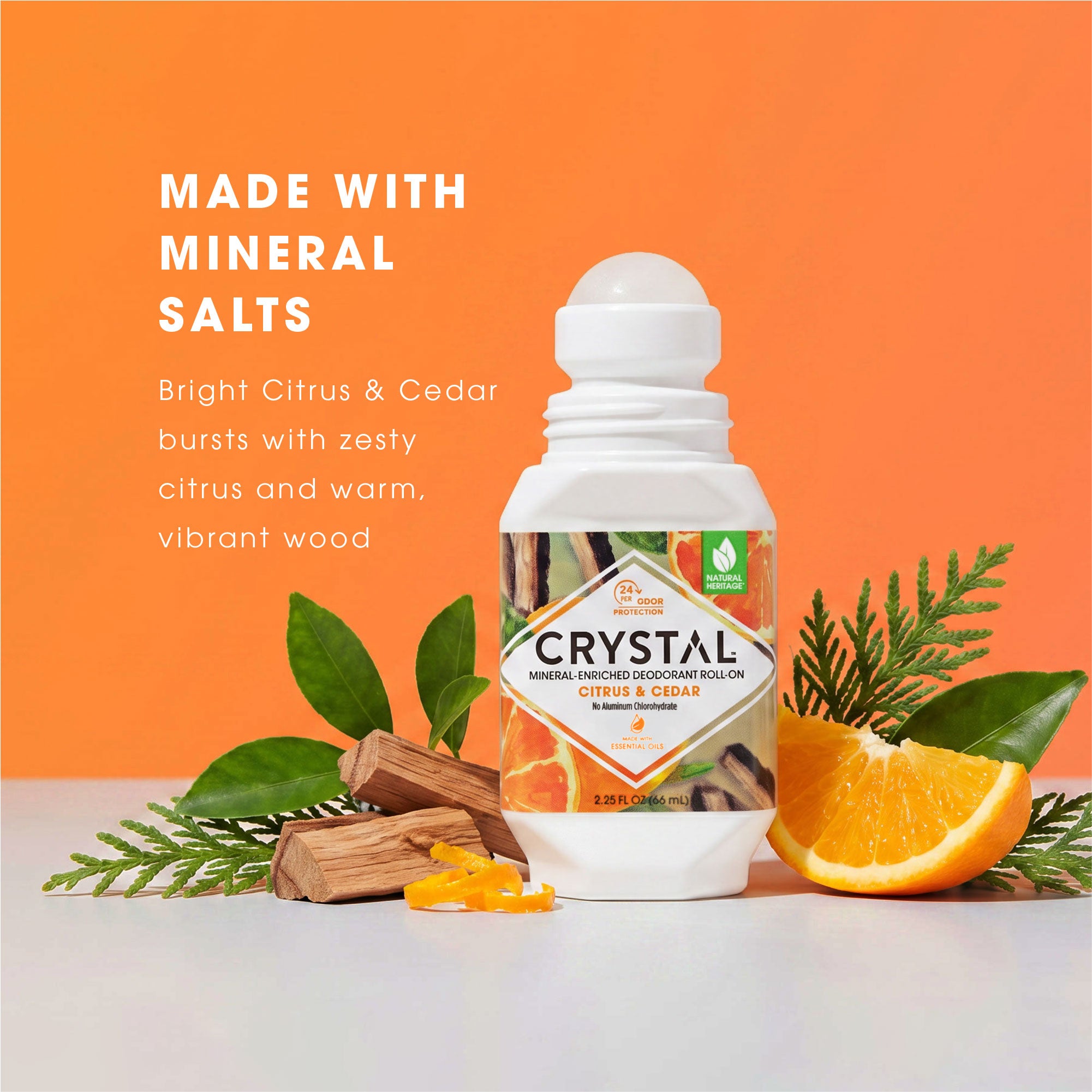Crystal deodorant roll-on with natural elements on an orange background