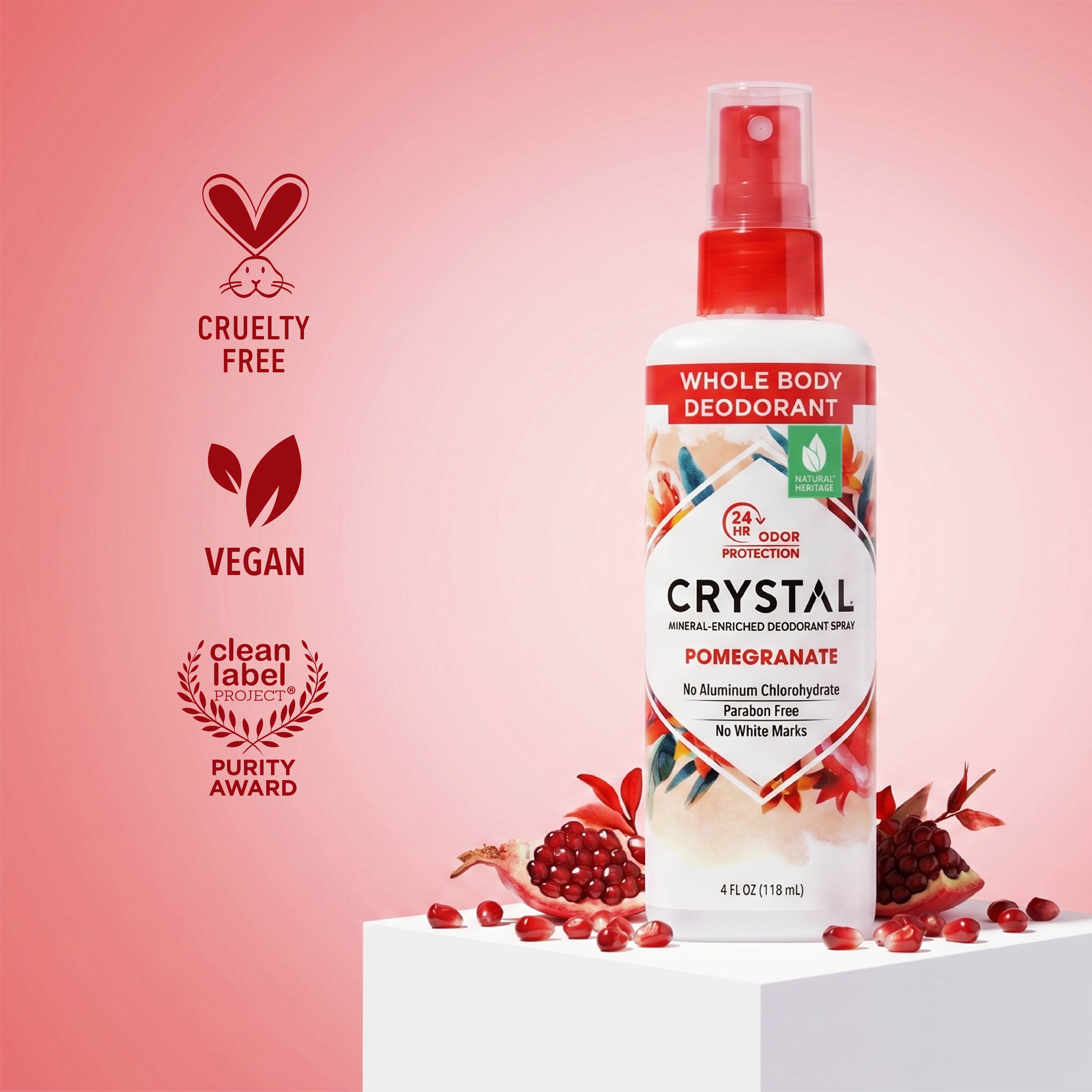 Crystal Whole Body Deodorant spray bottle with pomegranate flavor on a pink background, featuring cruelty-free, vegan, and clean label certifications.