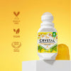 Crystal deodorant bottle with labels indicating cruelty-free, vegan, and clean label on a yellow background.