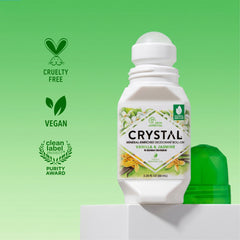 Crystal deodorant roll-on bottle with green background and certification logos.