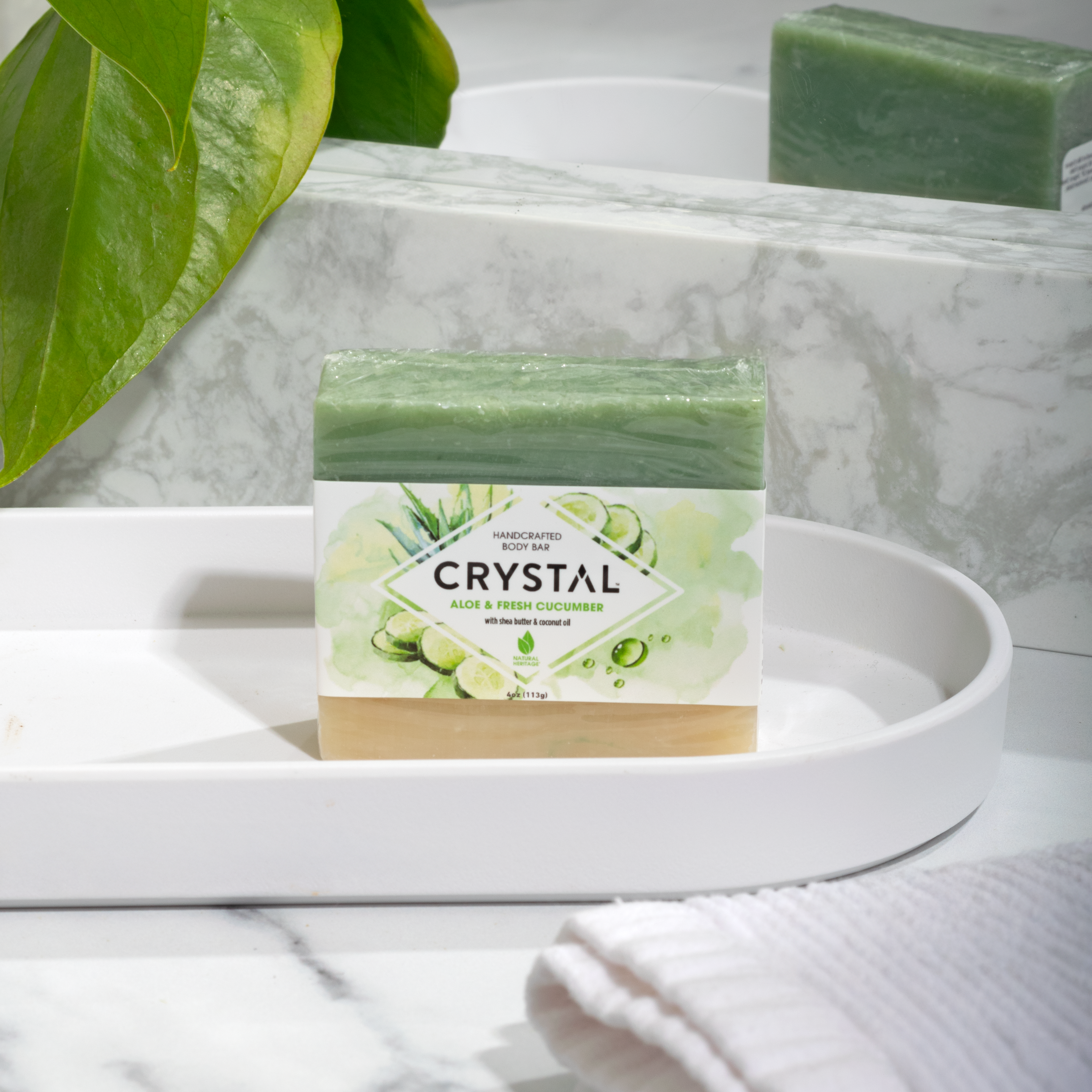 Crystal Soap bar with aloe and fresh cucumber in a primarily white bathroom setting.