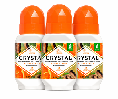 Three bottles of Crystal Mineral-Enriched Deodorant Roll-On with Citrus & Cedar scent on a white background.