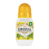Crystal deodorant roll-on bottle with chamomile and green tea ingredients on a white background